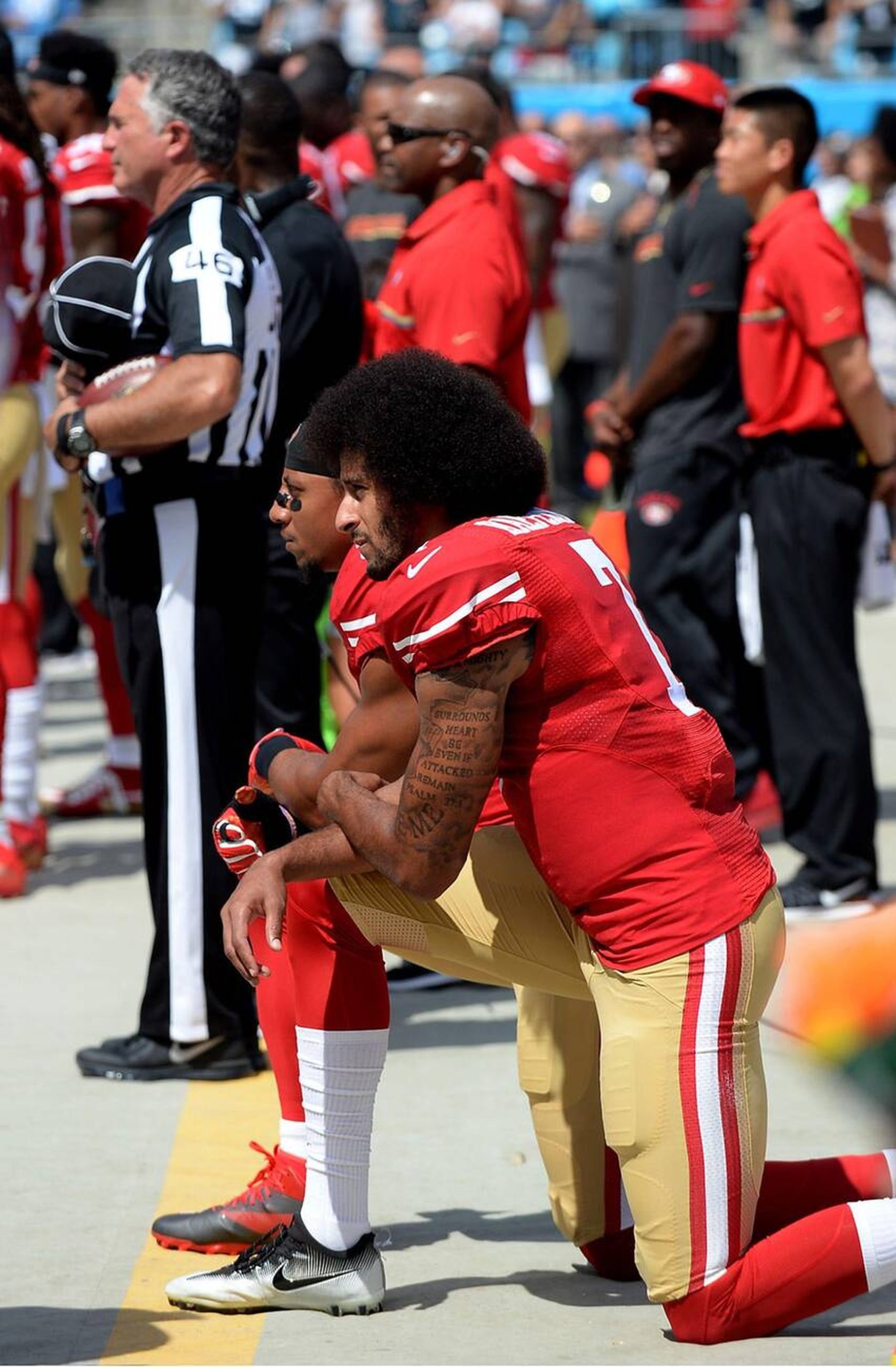 Colin Kaepernick kneeling on front 