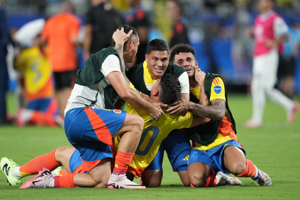 James Rodriguez of Colombia celebrates with teammates Juan Fernando Quintero, Luis Diaz following the  Copa America 2024 semifinal match between Uruguay and Colombia