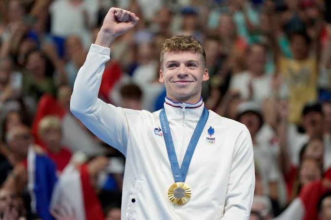 Leon Marchand with his gold medal | Source: The Independent